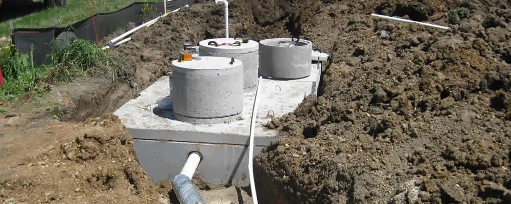 Septic system repair and installation site with tank access ports in West Palm Beach, FL