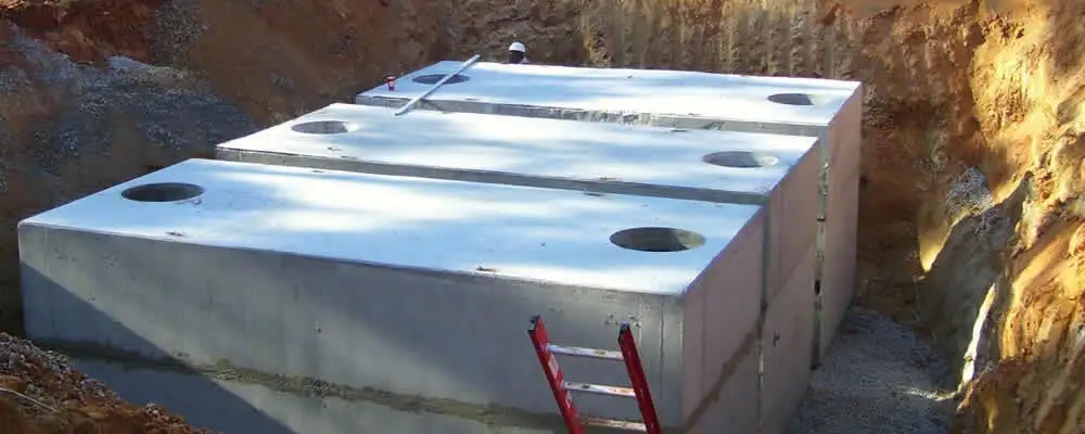 Septic tank installation site with a newly placed concrete tank in West Palm Beach, FL